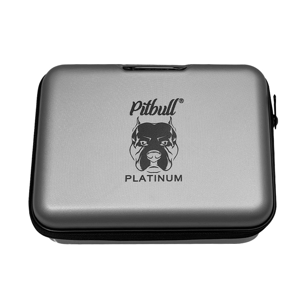 A silver Pitbull Deluxe Travel Case with a rectangular, compact design. The case displays the Pitbull logo along with the word “Platinum” on the front. It features a sturdy black zipper and a handle with the “Skull Shaver” brand etched on it, providing a sleek and practical storage solution for grooming tools.