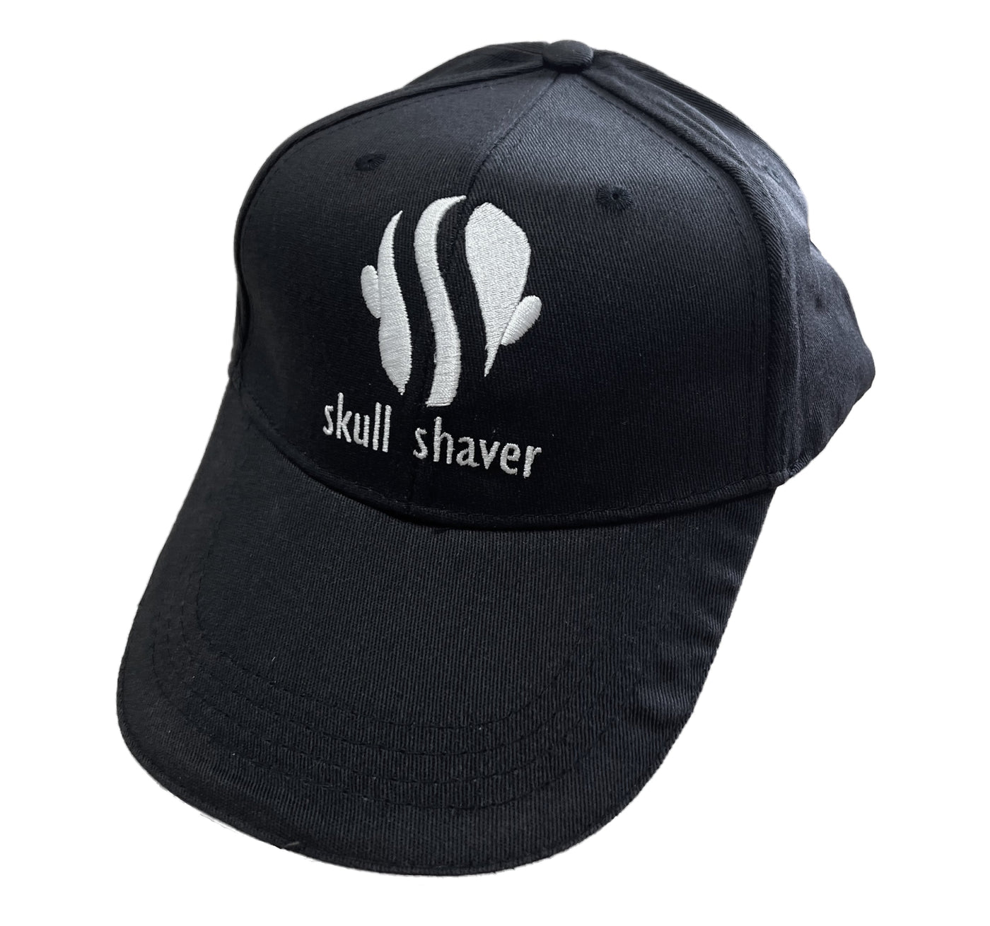 A black baseball cap with 'skull shaver' text on the front.