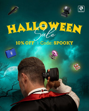  Skull Shaver promotional banner features a man dressed as a vampire shaves the back of his head with a Skull Shaver against a spooky, moonlit background featuring a haunted house and eerie trees. Floating Skull Shaver products surround him, including electric shavers and accessories. The Skull Shaver logo appears in the top right. Bold yellow text reads "HALLOWEEN Sale," with smaller text below stating "10% OFF | CODE: SPOOKY."

