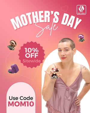 Skull Shaver Mother's Day Sale banner featuring a woman holding a Butterfly Kiss Pro shaver. Text reads ‘Mother’s Day Sale’ with ‘10% OFF sitewide’ and ‘Use coupon code MOM10’. Banner includes colour variants of the shaver. Skull Shaver logo on top left.
