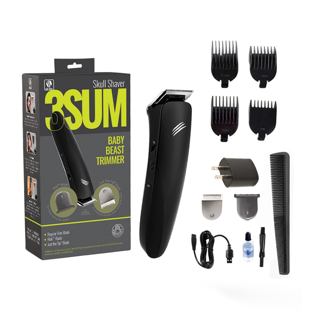 Skull Shaver 3SUM Baby Beast Trimmer with packaging, attachments, and plug on a white background
